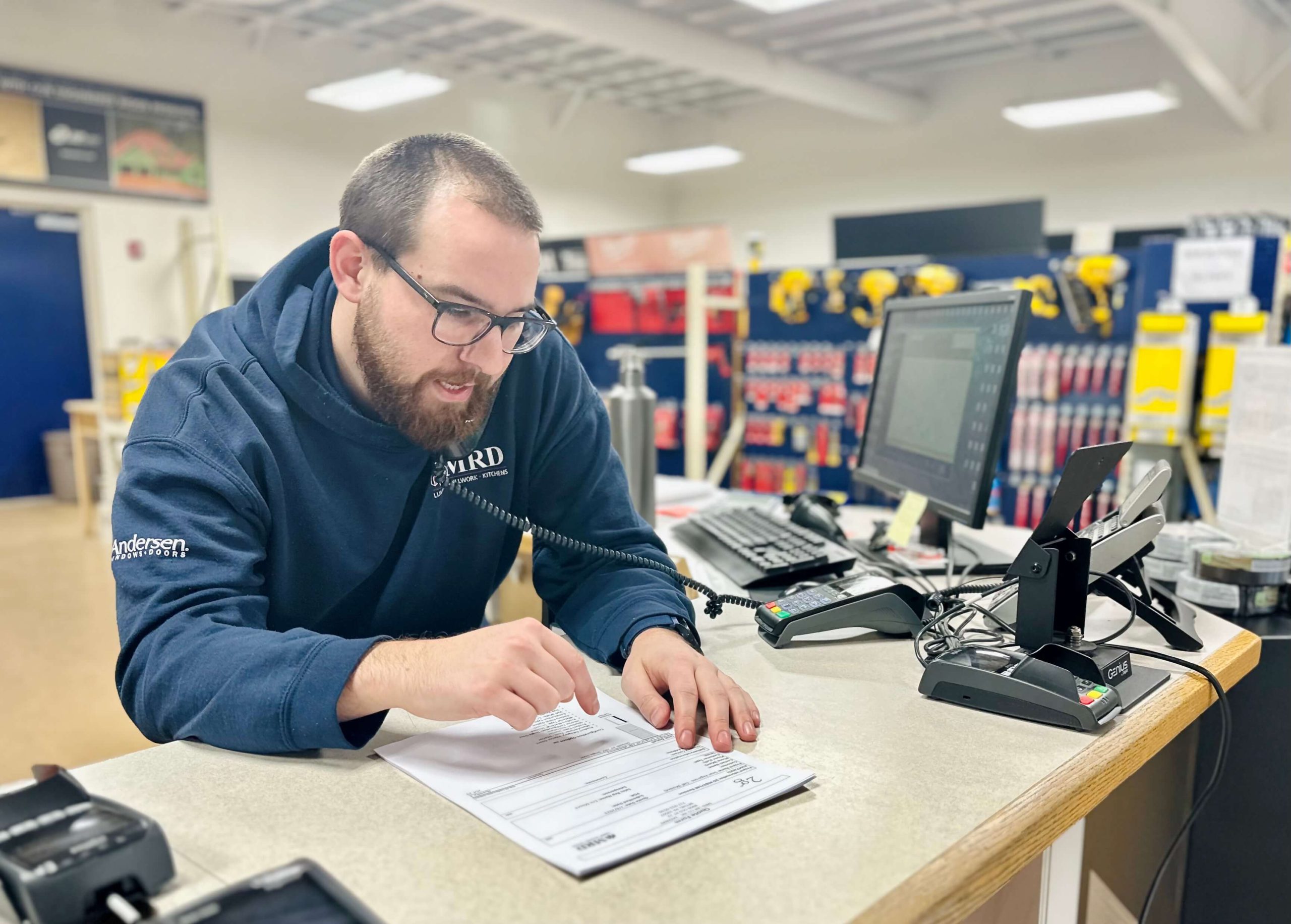 An MRD employee on the phone with a customer.