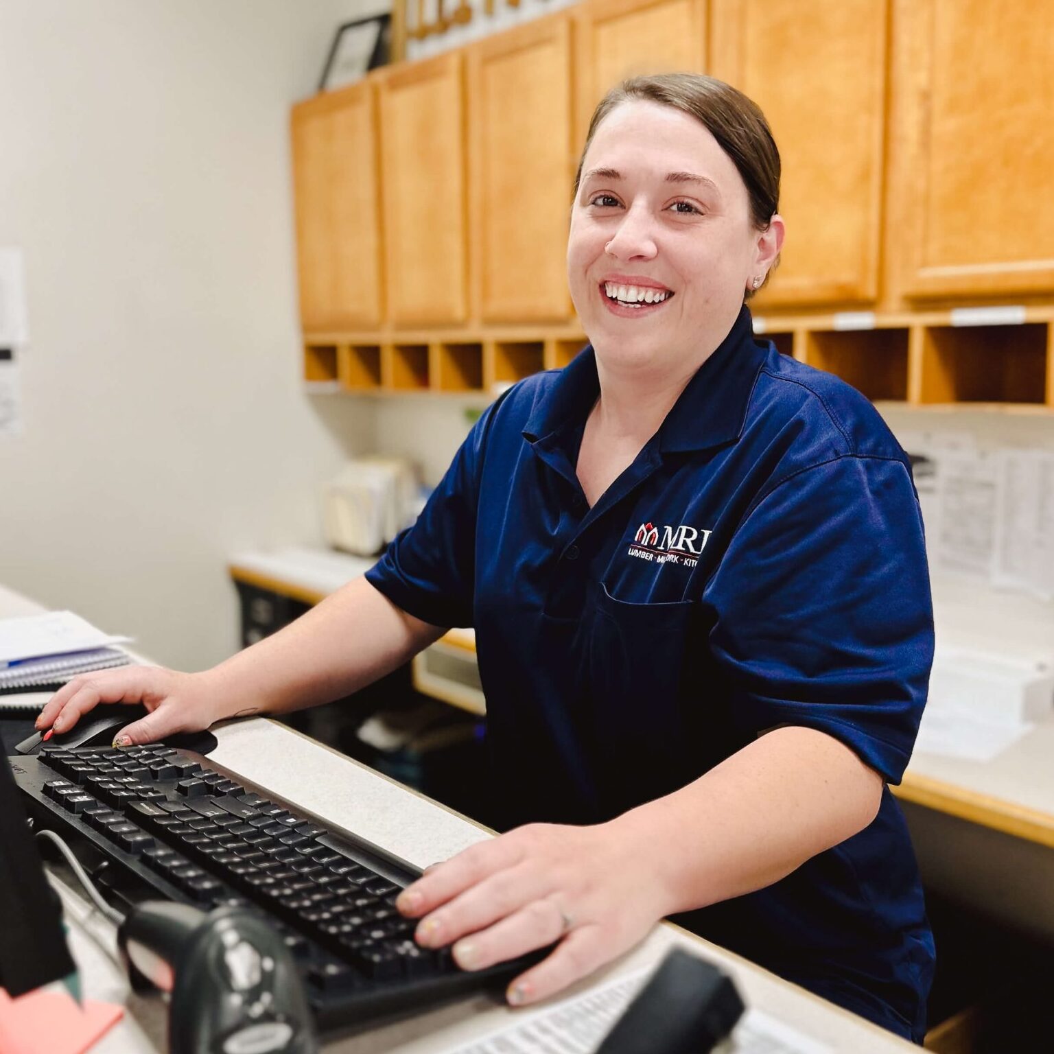 An MRD Employee With A Smile Working In The Office