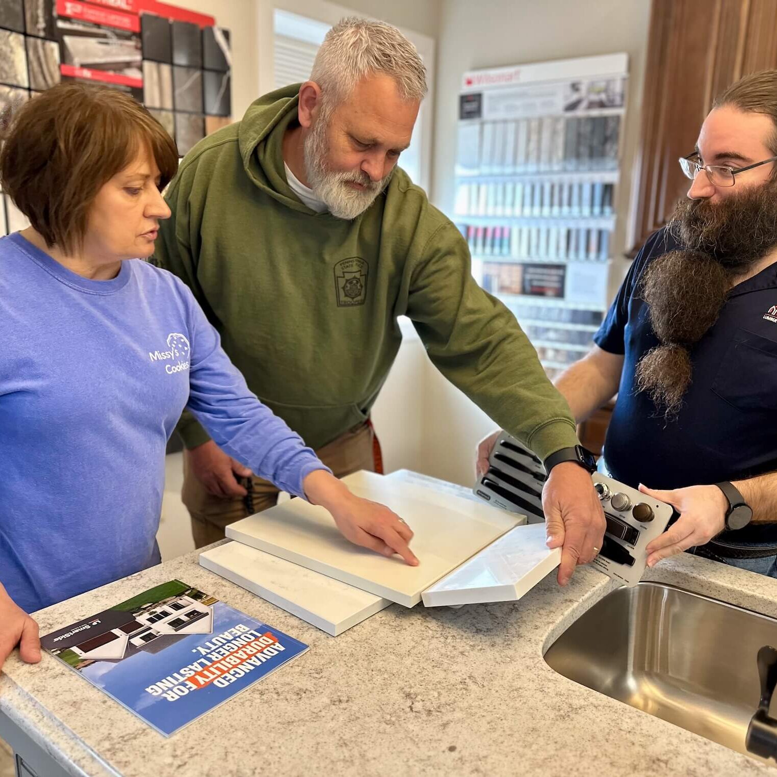An MRD employee going over countertop samples with customers.